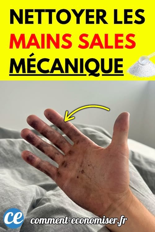 Main d’un mécanicien sale avec des traces de graisse noire sur la paume et les doigts.