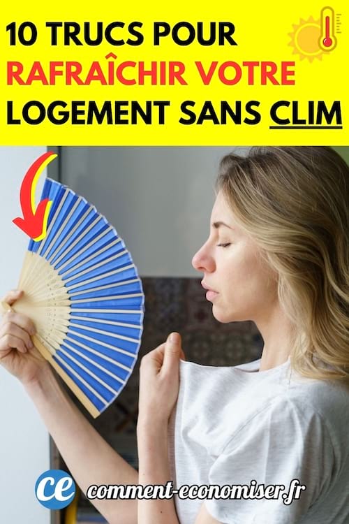 Une jeune femme utilise un éventail pour se rafraîchir