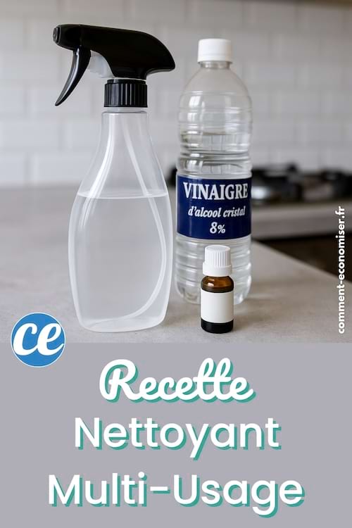 Flacon pulvérisateur transparent, bouteille de vinaigre blanc et petit flacon d’huile essentielle sur un plan de travail.