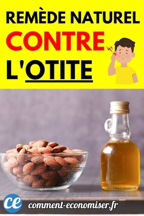 Un petit bol rempli d’amandes entières posé à côté d’une bouteille d’huile sur une table foncée.
