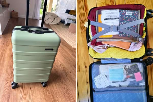 Une valise Cabine max dans la maison avec des affaires dedans