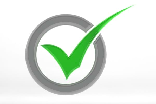 Une coche verte entourée d’un cercle gris, symbole de validation.
