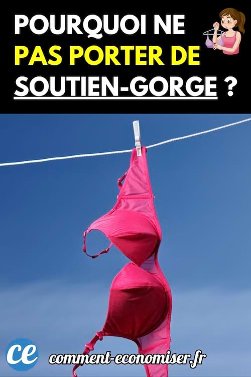 Soutien-gorge rose accroché à une corde à linge avec une pince à linge blanche sur fond de ciel bleu.