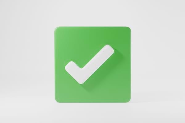 Icône verte avec une coche blanche indiquant l'approbation ou la validation.