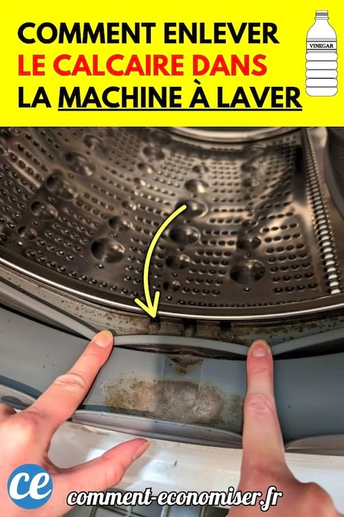 Gros plan sur l’intérieur d’un tambour de machine à laver avec des traces de calcaire visibles.