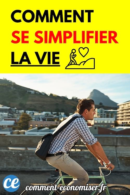 Un homme en chemise à carreaux roule à vélo en ville avec un sac en bandoulière.