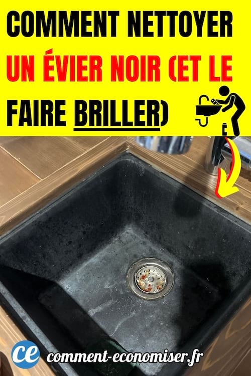 un évier de cuisine noir avec des traces de calcaire et d'eau