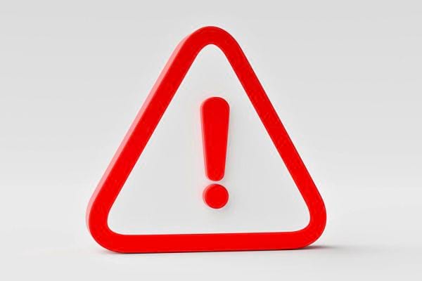 Panneau triangulaire rouge avec point d’exclamation.