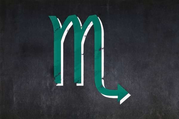 Symbole du Scorpion en vert sur fond noir représentant un signe mystérieux.