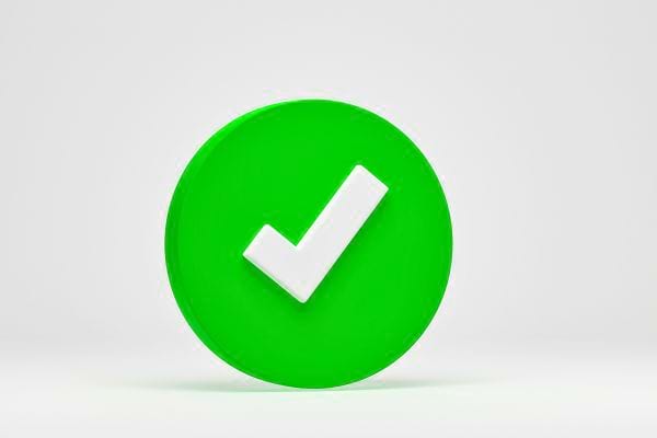 Un cercle vert avec une coche blanche au centre.