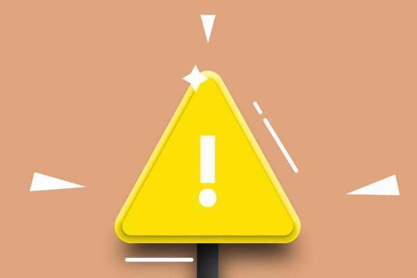 Un panneau triangulaire jaune avec un point d’exclamation avertit d’un danger ou d’un risque pour la santé.