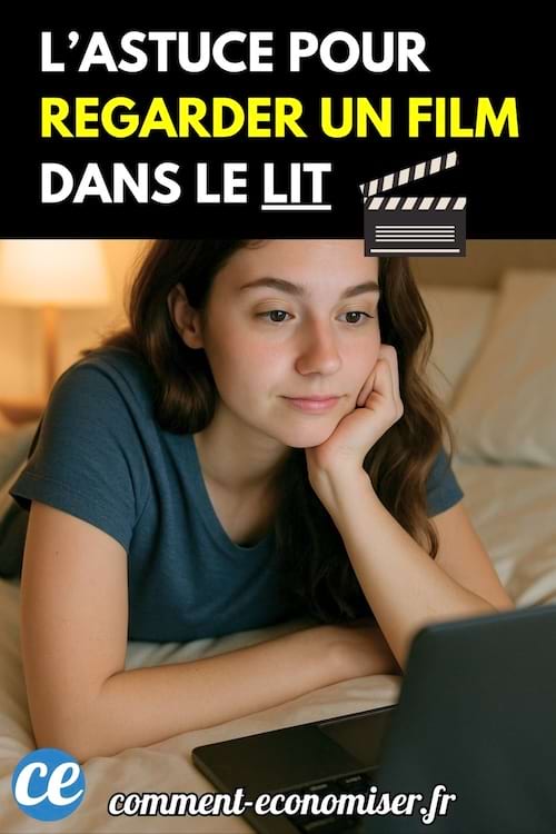 Une femme regarde un film sur son ordinateur portable depuis son lit.