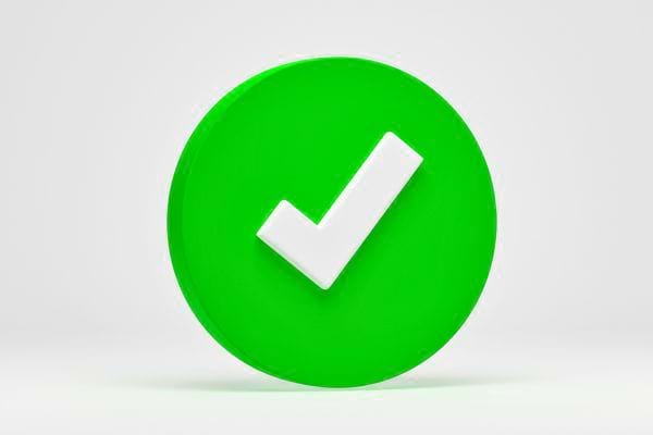 Un cercle vert avec une coche blanche au milieu.
