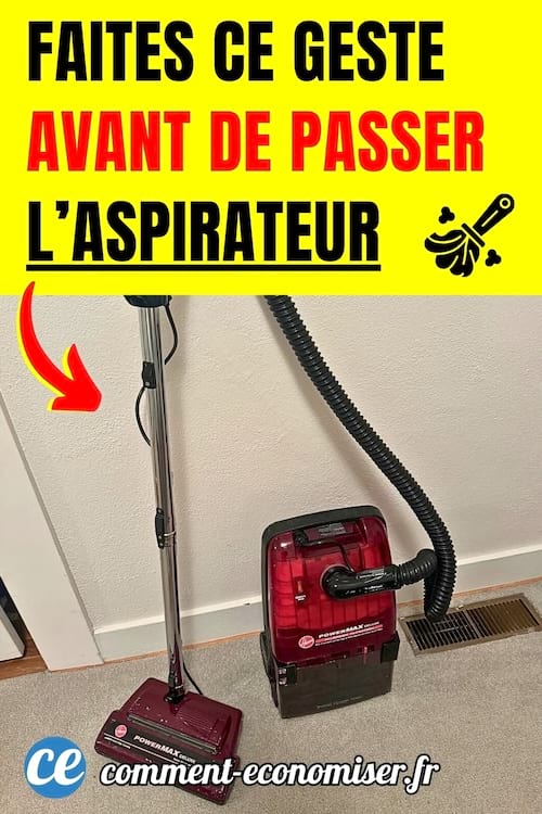 Un aspirateur rouge contre le mur de la maison 