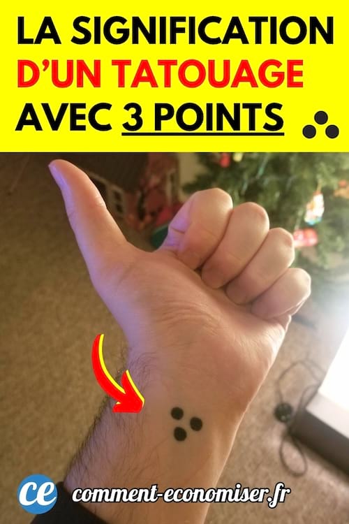 Une main avec un tatouage de trois points dessus