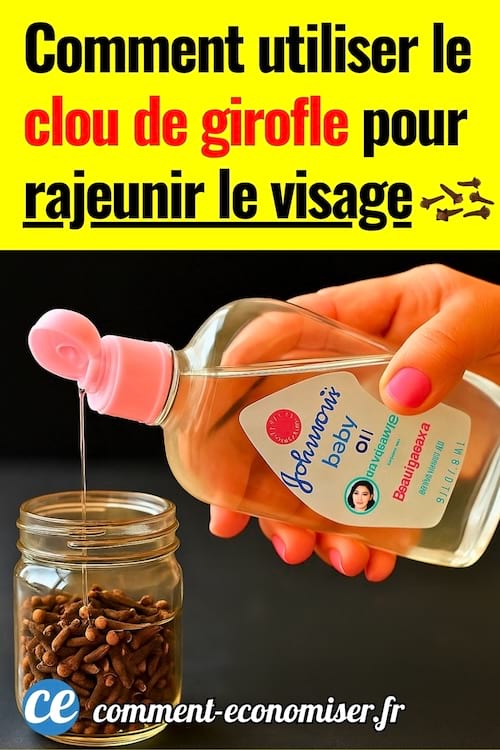 Une main qui verse de l'huile hydratante pour bébé dans un bocal de clous de girofle.