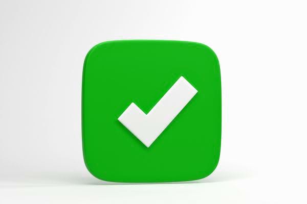 Une icône verte affiche un grand symbole de validation blanc.