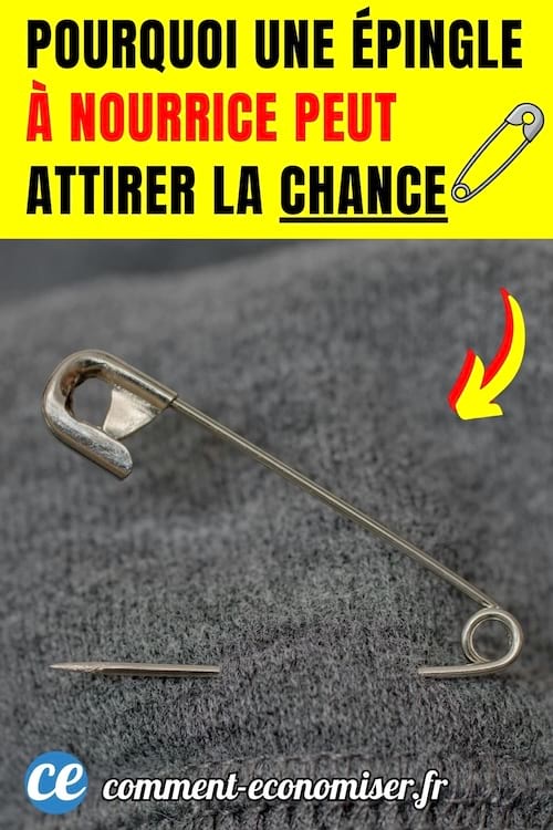 une &eacute;pingle &agrave; nourrice ouverte plant&eacute;e dans un pull