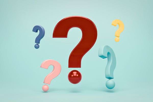 plusieurs points d interrogation de differentes couleurs sur fond clair