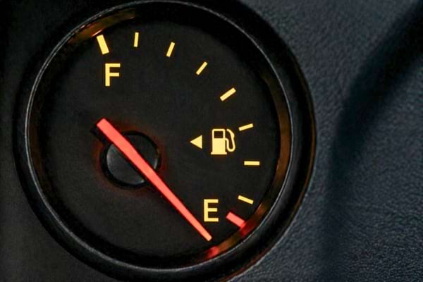 small triangle arrow pointing to the gas tank side