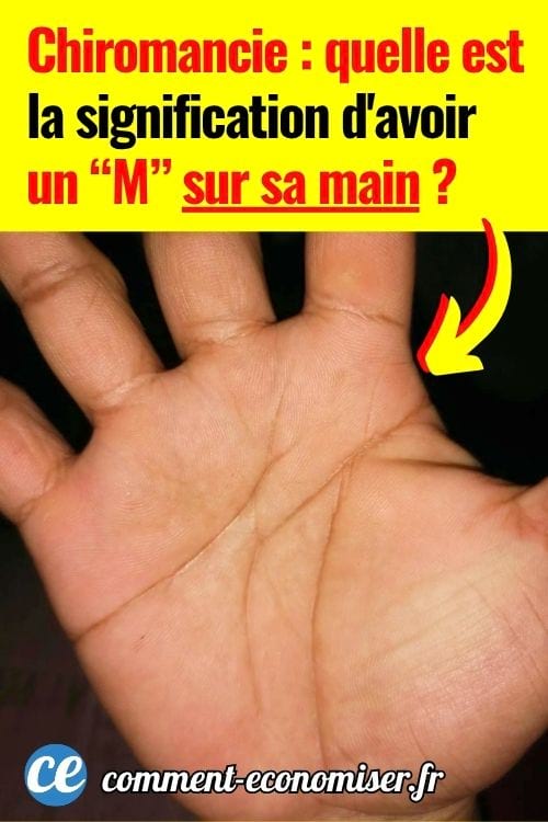 Gros plan sur une paume avec lignes formant un M, fond sombre