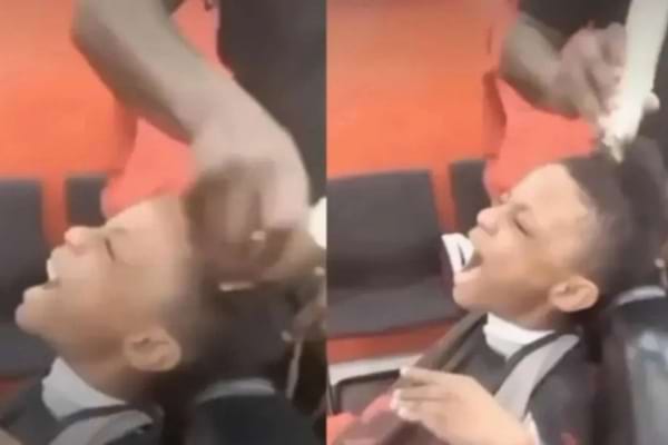 un enfant qui se fait raser les cheveux et qui crie