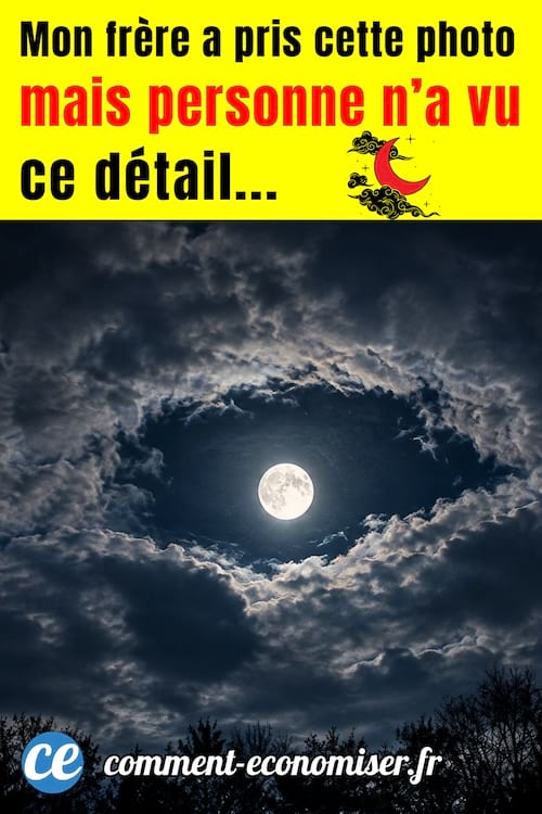photo de la pleine lune entourée de nuages formant une forme d'oeil dans le ciel