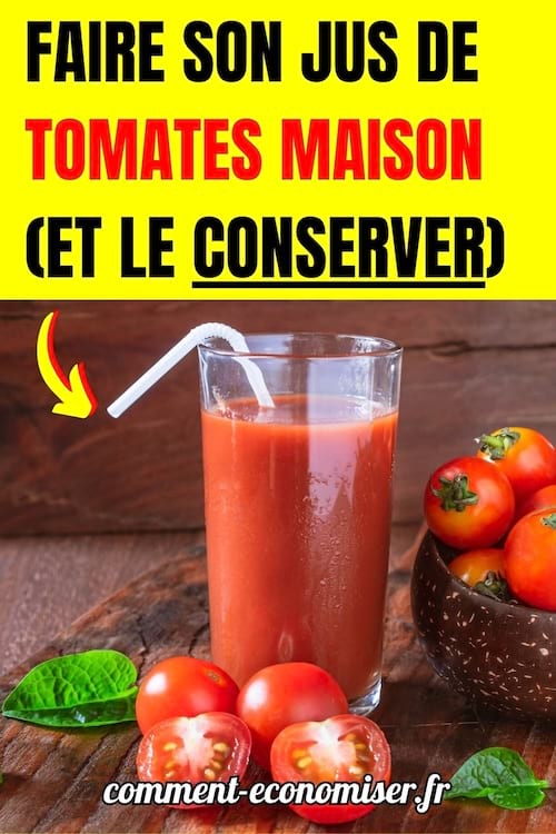 un jus de tomates frais fait maison dans un verre avec une paille et des tomates posées sur une table