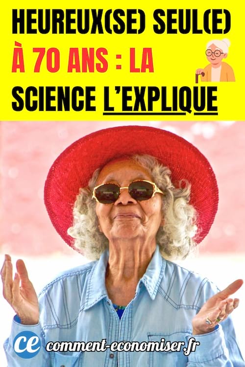 une femme &acirc;g&eacute;e heureuse avec un grand chapeau rouge et des lunettes de soleil