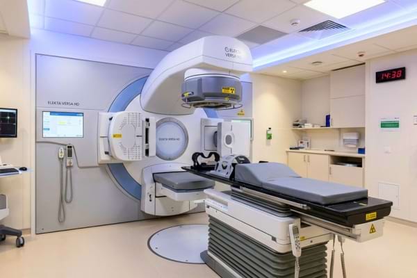 a modern medical radiotherapy machine in a clean hospital room