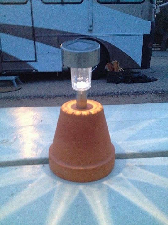 Did you know that with a solar garden light and a flower pot you have a great light for your camping table?