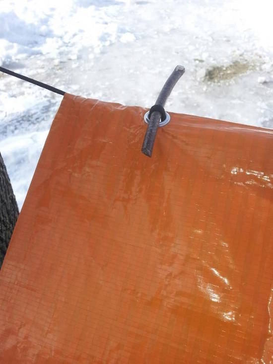 With small pieces of rubber tubing, you can hang your plastic tarp without wasting time putting it on!