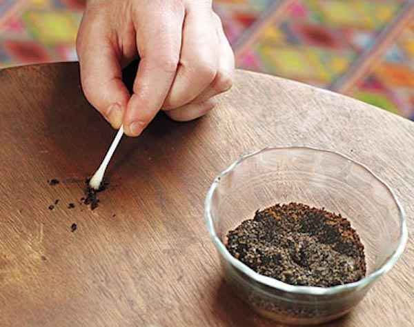 Use coffee grounds to hide scratches on furniture