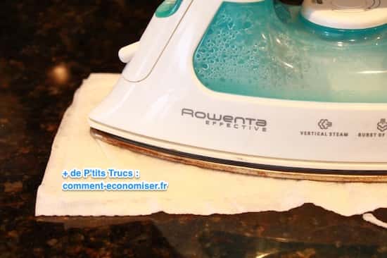 Let the soleplate of your iron rest on a paper towel soaked in white vinegar.