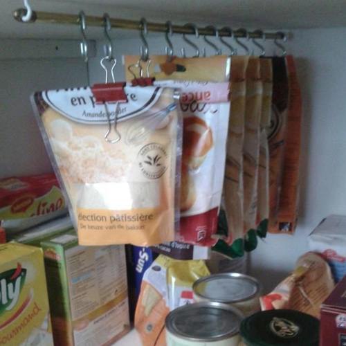 Use clipboards to organize kitchen cupboards