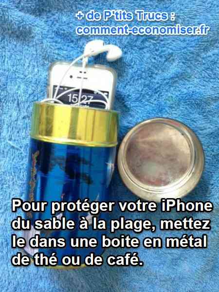 un iphone dans une boite en métal sur une serviette